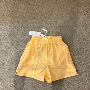 Never worn before (tags on) yellow lounge shorts